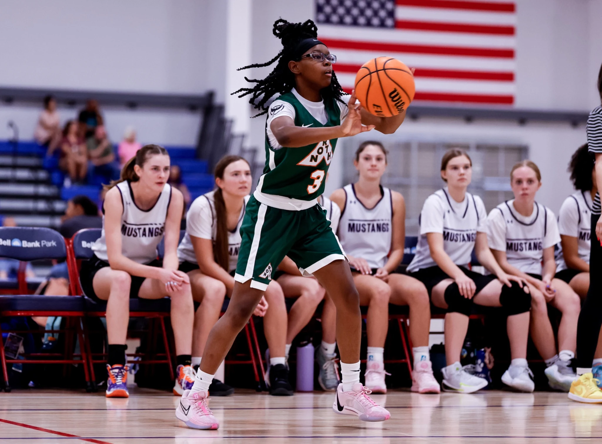 Girls basketball player attacking the basket