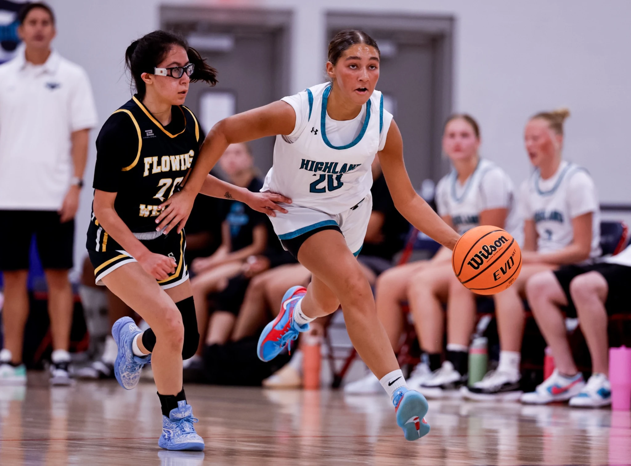 Girls high school basketball players competing at Section 7